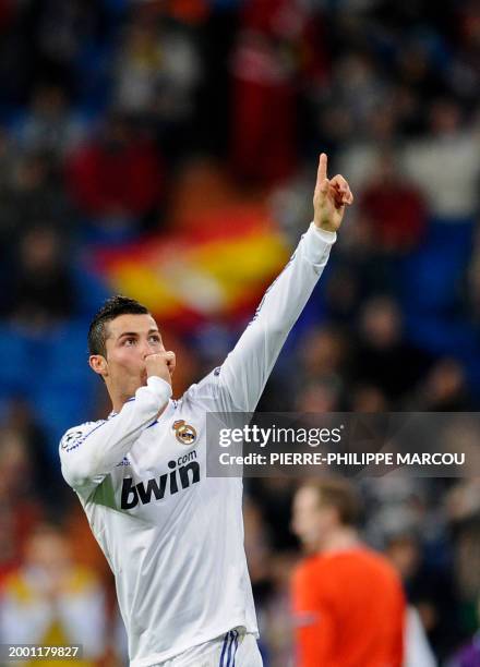 Real Madrid's Portuguese forward Cristiano Ronaldo celebrates his goal during the UEFA Champions League football match Real Madrid vs AJ Auxerre on...