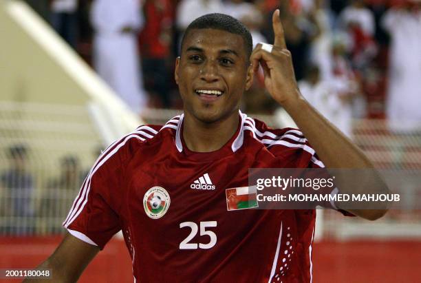 Oman's Khalifa Ayil celebrates after scoring a goal against Australia during their 2011 Asian Cup group B qualifying football match in Muscat on...