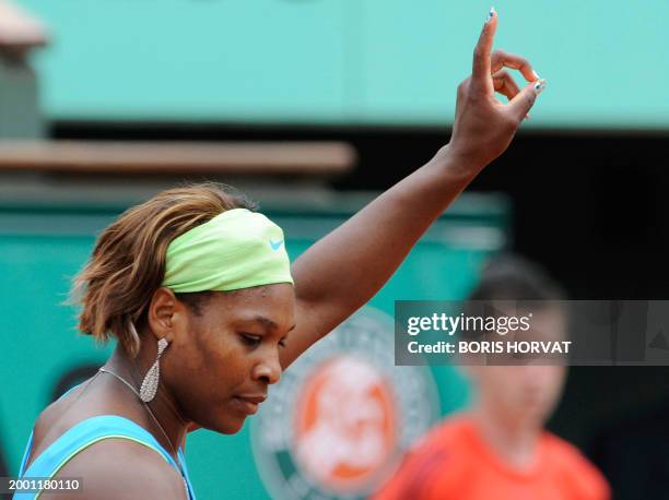 Serena Williams serves to Russia's Anastasia Pavlyuchenkova during their women's third round match in the French Open tennis championship at the...