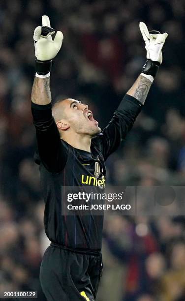 Barcelona's goalkeeper Victor Valdes celebrates after teammate Argentinian forward Lionel Messi scored Barcelona's third goal during the UEFA...