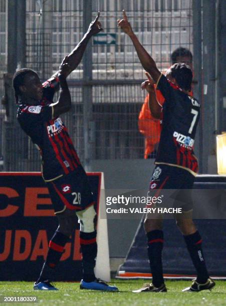 Nice's forward Mamadou Bagayoko and Loic Remy jubilates after a scoring a second goal during their French L1 football match Nice vs Lyon on October...