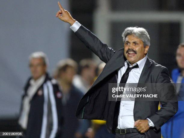 Monaco's coach Guy Lacombe gestures during the French L1 football match Nice vs. Monaco, on September 19, 2009 at the Ray Stadium in Nice. AFP PHOTO...