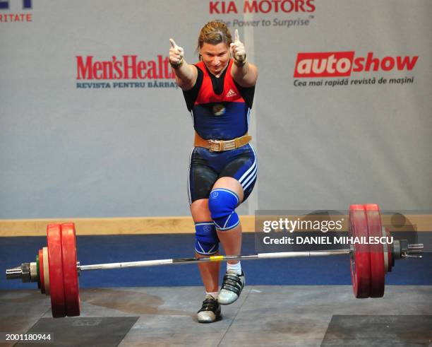 Tatiana Matveeva from Russia, winner of bronze medal, celebrates after her lift in the Women 69kg category of the European Weightlifting Championship...