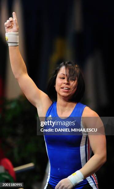 Anais Michel from France reacts during the Women 48kg category of the European Weightlifting Championship in Bucharest April 6, 2009. AFP PHOTO...