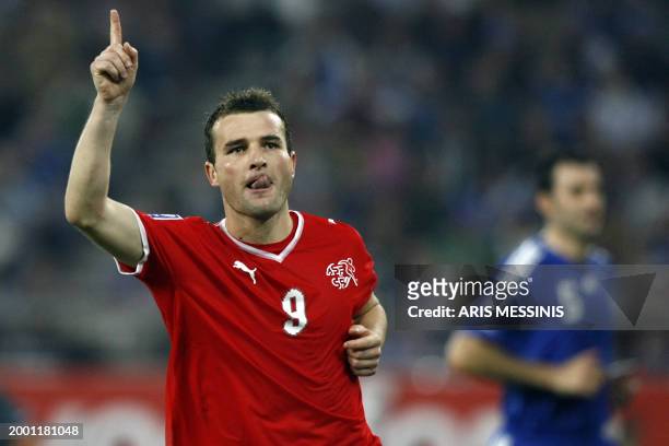 Alexander Frei of Switzerland celebrates after scoring against Greece during their group 2 qualification football game for the 2010 World Cup at the...