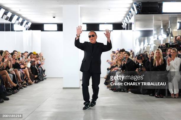 Designer Michael Kors acknowledges applause after his show during New York Fashion Week on February 13, 2024 in New York.