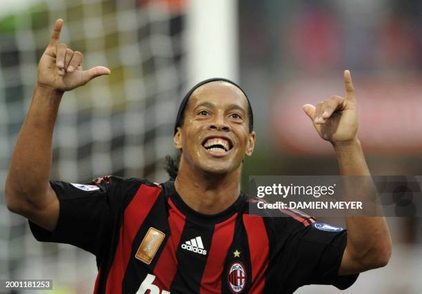 Milan's Brazilian forward Ronaldinho celebrates after scoring his second goal against Sampdoria during their Italian Serie A match on October 19,...