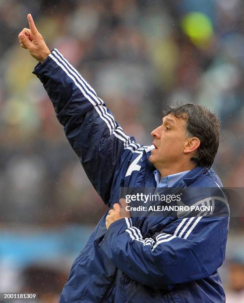 Paraguay's team coach Gerardo Martino gestures during their FIFA World Cup South Africa 2010 qualifier football match against Argentina, at the...