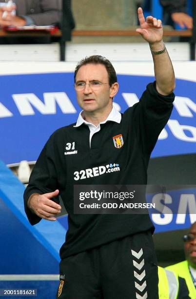 Aston Villa manager Martin O'Neill gestures as he watches his team play Chelsea during their Premeirship game at Stamford Bridge in west London, 30...