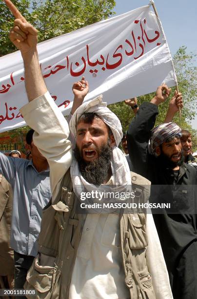 Afghan protestors shout slogans as they march towards the Tolo television station during a protest in Kabul, 21 April 2007. People rallied in the...