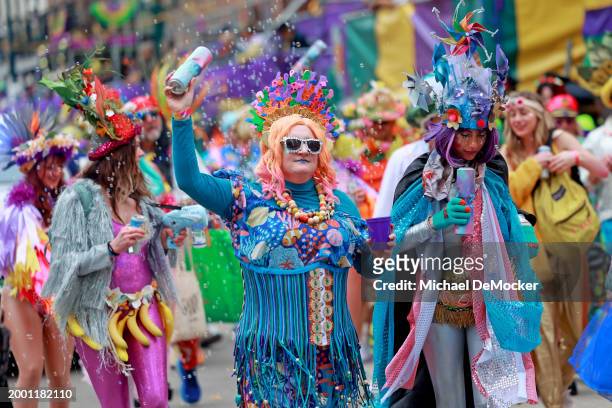The Mondo Kayo marching club performs as the over 1,100 riders of the Krewe of Zulu make their way down St. Charles Avenue on Mardi Gras Day with...