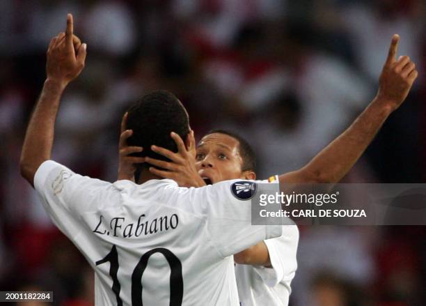 Sevilla's Brazilian forward Luis Fabiano is congratulated by teammate after scoring a goal during the UEFA cup final football match Middlesbrough vs....