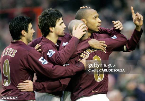 Arsenal's Captain Thierry Henry celebrates his goal with team mates, from left, Jose Antonio Reyes, Francesc Fabregas, and Freddie Ljungberg during...