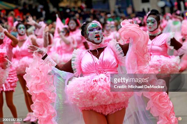 The Krewe of Baby Doll Ladies performs as the over 1,100 riders of the Krewe of Zulu make their way down St. Charles Avenue on Mardi Gras Day with...