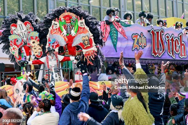 The Witch Doctor waves to the crowd from his float as the over 1,100 riders of the Krewe of Zulu make their way down St. Charles Avenue on Mardi Gras...