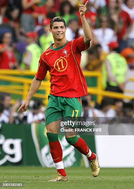 Portuguese forward Cristiano Ronaldo celebrates after scoring on 30 June 2004 at the Alvalade stadium in Lisbon, during the Euro 2004 semi final...