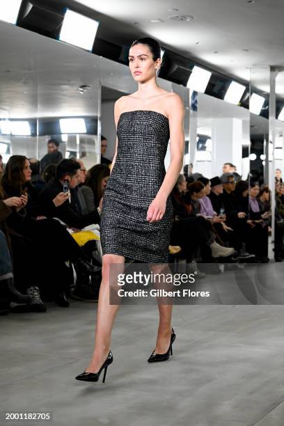 Amelia Gray on the runway at Michael Kors RTW Fall 2024 as part of New York Ready to Wear Fashion Week held on February 13, 2024 in New York, New...
