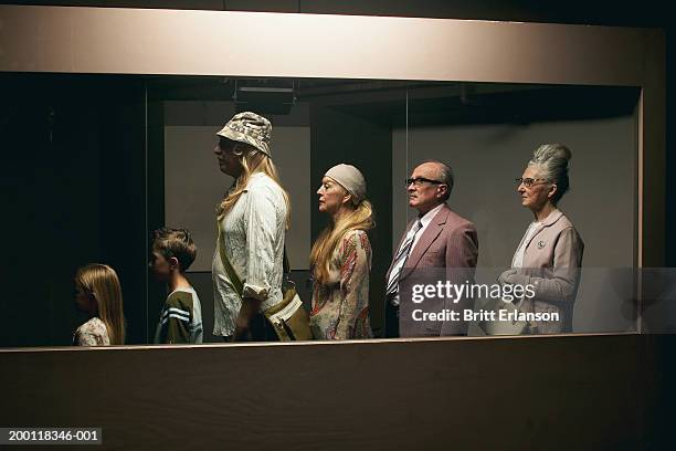 people standing in line behind glass partition - line up stock pictures, royalty-free photos & images