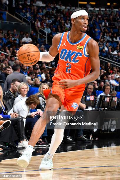 Shai Gilgeous-Alexander of the Oklahoma City Thunder dribbles the ball during the game against the Orlando Magic on February 13, 2024 at the Kia...