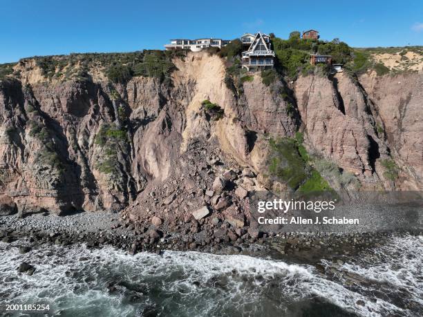 Dana Point, CA An aerial view of three large homes in Dana Point are in danger of falling into the ocean after a cliffside gave way over the weekend...