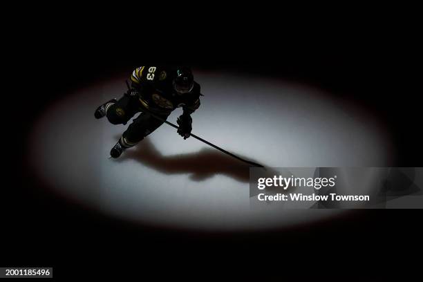 Brad Marchand of the Boston Bruins takes the ice for his 1000th career NHL game against the Tampa Bay Lightning at TD Garden on February 13, 2024 in...