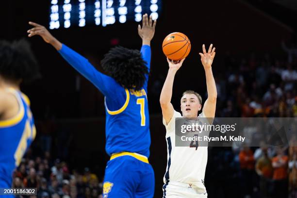 Andrew Rohde of the Virginia Cavaliers shoots against Carlton Carrington of the Pittsburgh Panthers in the second half at John Paul Jones Arena on...