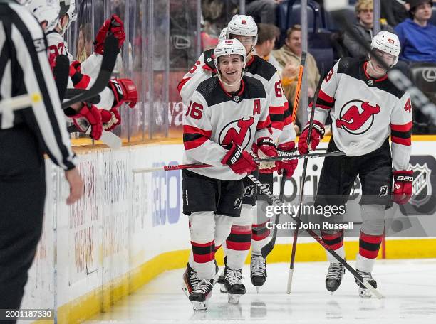 Jack Hughes of the New Jersey Devils celebrates his goal against the Nashville Predators during an NHL game at Bridgestone Arena on February 13, 2024...