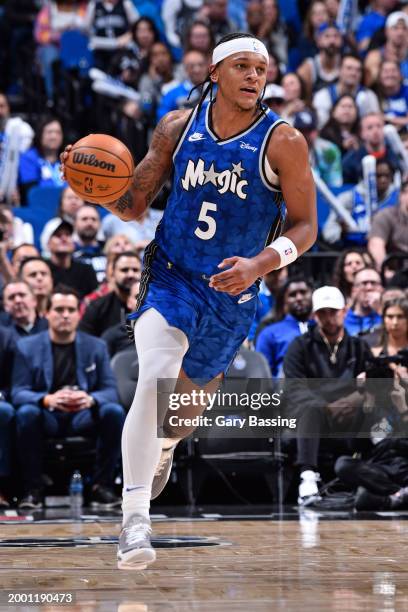 Paolo Banchero of the Orlando Magic dribbles the ball during the game against the Oklahoma City Thunder on February 13, 2024 at the Kia Center in...