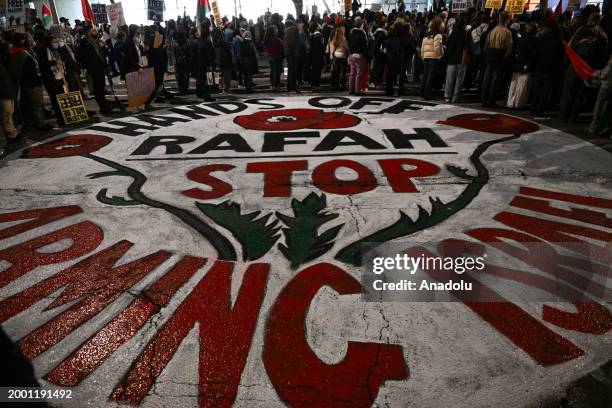 Hundreds of protesters are gathered and Palestinian solidarity mural painted outside of Federal Building to protest Israeli attacks on Gaza and...