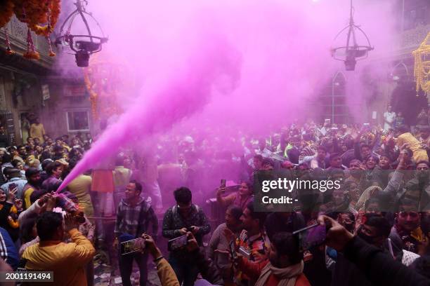 Hindu devotees throw coloured powder during 'Basant Panchami' festival celebrations, which mark the preparations for the arrival of spring, inside...