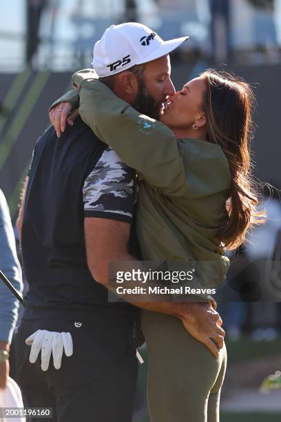 Captain Dustin Johnson of 4Aces GC celebrates with his wife Paulina Gretzky after winning the individual trophy during day three of the LIV Golf...