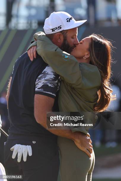 Captain Dustin Johnson of 4Aces GC celebrates with his wife Paulina Gretzky after winning the individual trophy during day three of the LIV Golf...