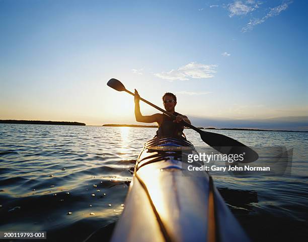 usa, florida, everglades, man kayaking, sunset - kayaking stock pictures, royalty-free photos & images