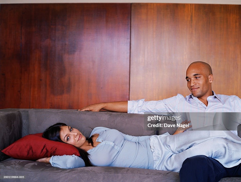 Young couple relaxing on sofa