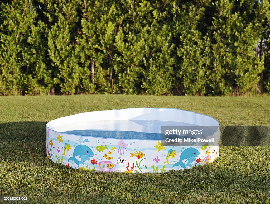 Plastic swimming pool filled with water