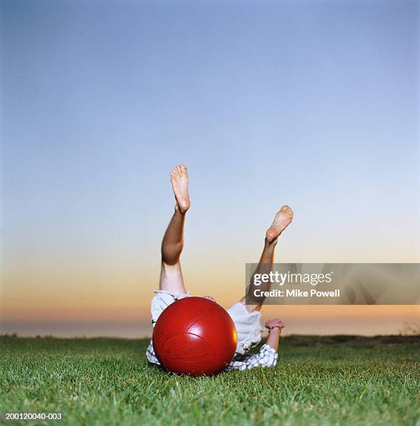 young man falling off  bounce and hop ball - hoppity horse 個照片及圖片檔