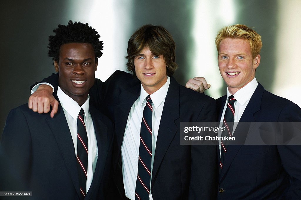 Three young men wearing suits, portrait