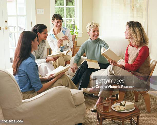 women laughing in book club - book club meeting stock pictures, royalty-free photos & images