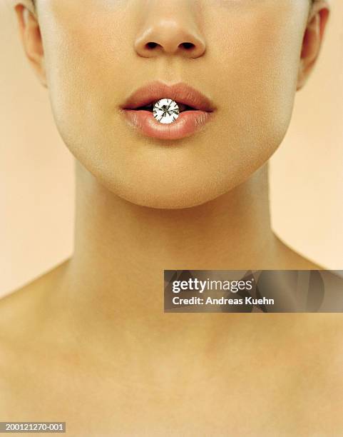woman with diamond in mouth, close up - silver spoon in mouth stock pictures, royalty-free photos & images