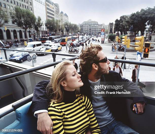 spain, barcelona, couple in open top bus - barcelona tours stock pictures, royalty-free photos & images