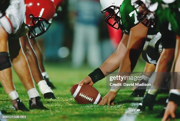 american football line of scrimmage, ground view (digital enhancement) - face off sports play stock pictures, royalty-free photos & images