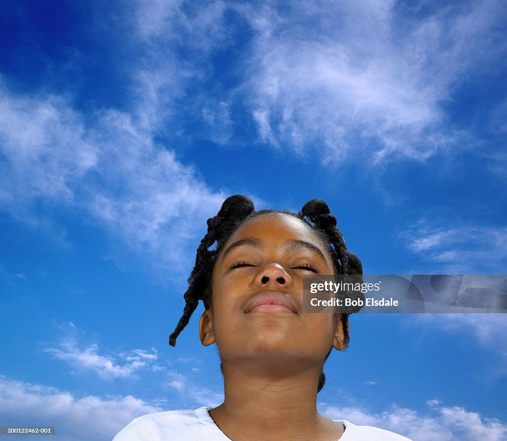 Girl (9-11), eyes closed, sky in background (Digital Composite)