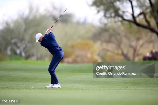 Daniel Berger of the United States plays an approach shot on the first hole during the third round of the WM Phoenix Open at TPC Scottsdale on...