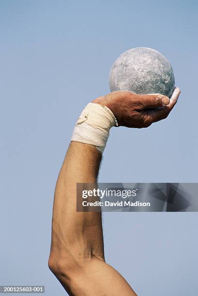 male shot putter holding shot, close-up of arm - shot put stock pictures, royalty-free photos & images