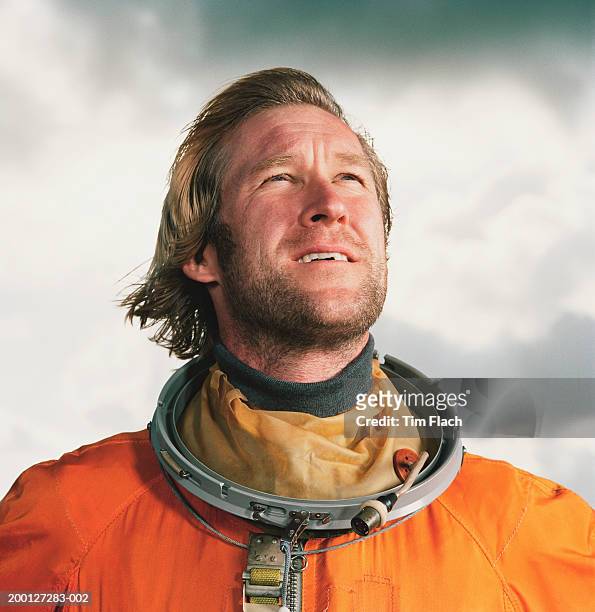 man wearing space suit, outdoors, close-up - tim flach stock-fotos und bilder