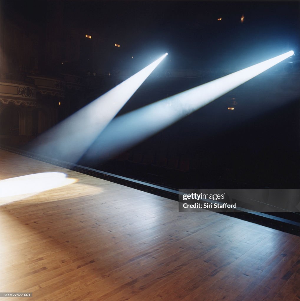 Beams of spotlights shining on stage floor