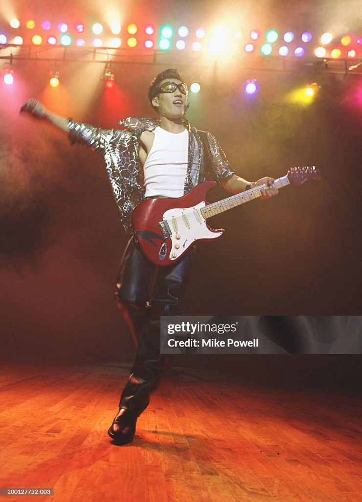 Guitar player performing on stage