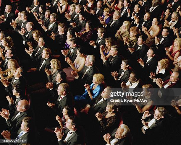 theater audience wearing formal attire, applauding, overhead view - audiance stock pictures, royalty-free photos & images