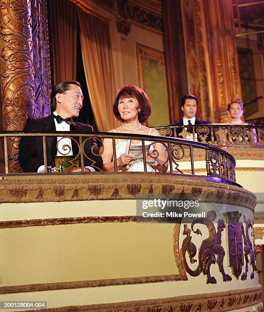 couple sitting in balcony of theater - theatre box stock pictures, royalty-free photos & images