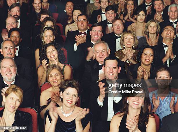theater audience in formal attire, applauding, portrait - opéra style musical photos et images de collection